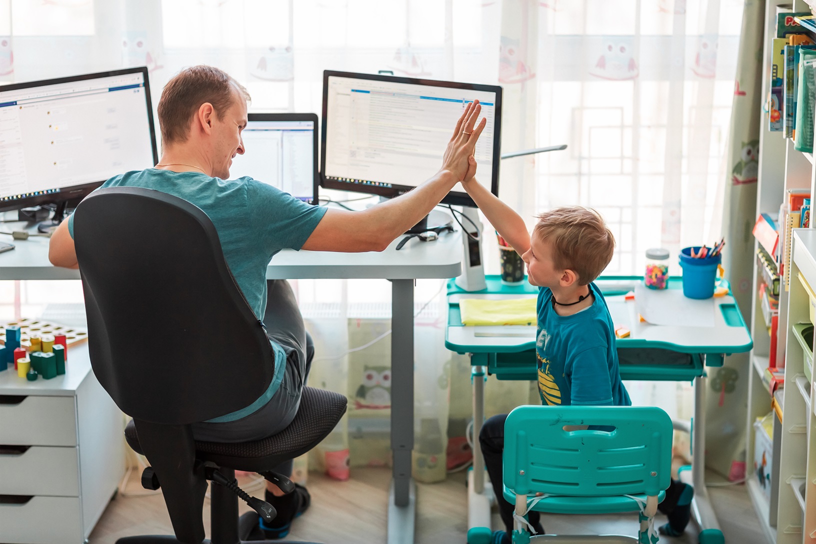 Father,With,Kid,Trying,To,Work,From,Home,During,Quarantine.